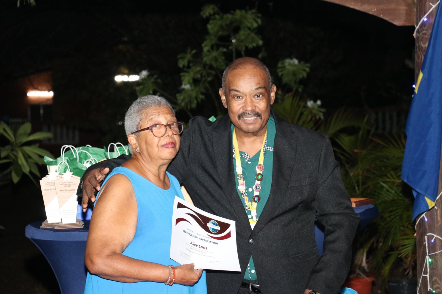 Alice Loos receives a certificate of appreciation