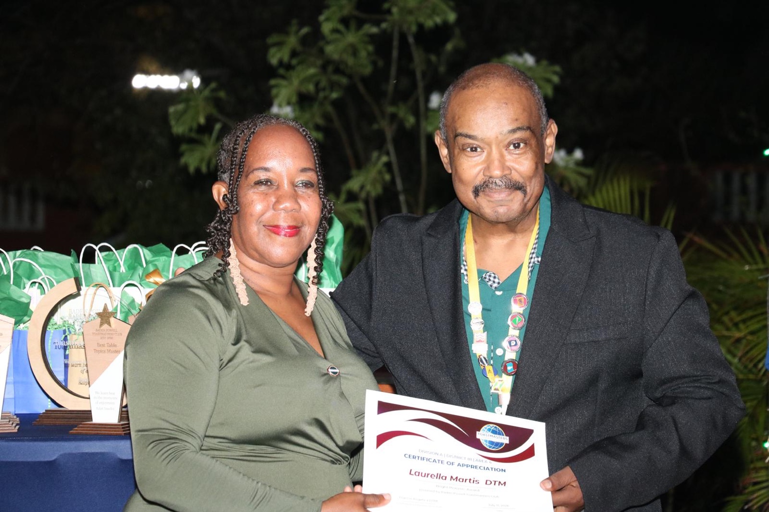 Laurella Martis, DTM, receives a certificate of appreciation